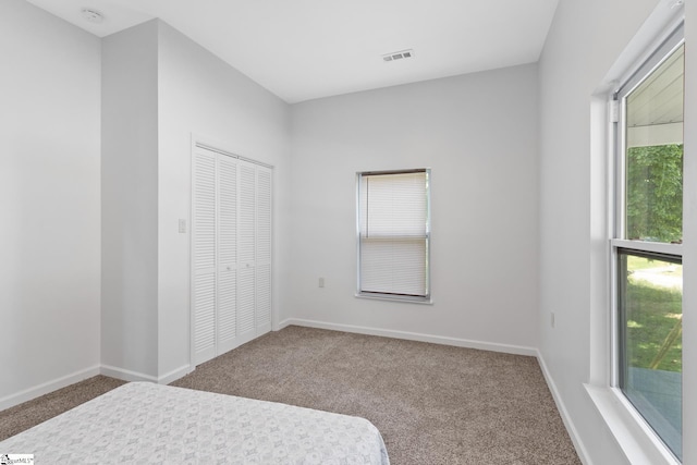 904 W Hampton St, Laurens, SC 29360 - unfurnished bedroom with carpet floors and a closet