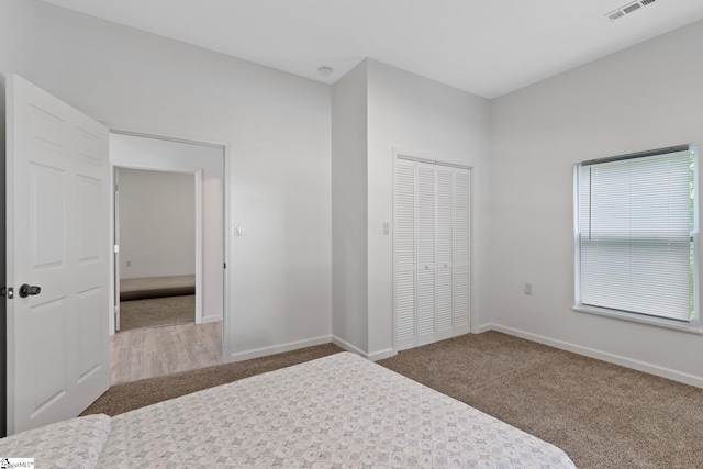 904 W Hampton St, Laurens, SC 29360 - bedroom with carpet floors and a closet