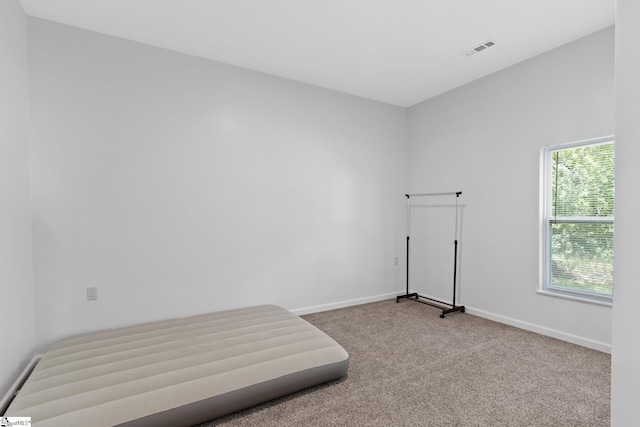 904 W Hampton St, Laurens, SC 29360 - unfurnished bedroom with carpet flooring and baseboards