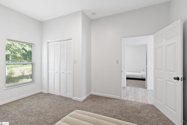 904 W Hampton St, Laurens, SC 29360 - unfurnished bedroom with carpet and a closet