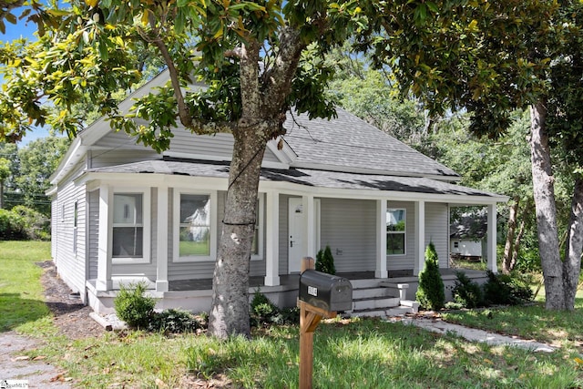 904 W Hampton St, Laurens, SC 29360 - view of front of home with roof with shingles and covered porch
