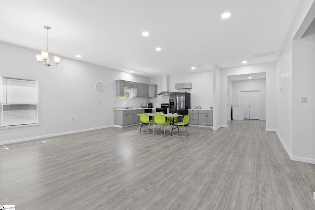 904 W Hampton St, Laurens, SC 29360 - living room featuring recessed lighting, light wood-style flooring, and a chandelier