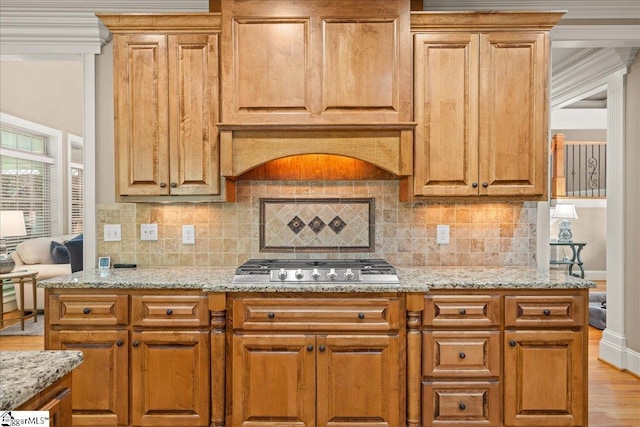 112 Griffith Hill Way, Greer, SC 29650 - kitchen featuring stainless steel gas cooktop, light stone countertops, decorative backsplash, and crown molding