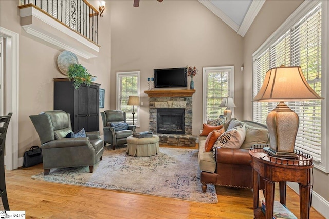 112 Griffith Hill Way, Greer, SC 29650 - living area featuring high vaulted ceiling, crown molding, wood finished floors, a fireplace, and a ceiling fan