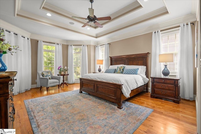 112 Griffith Hill Way, Greer, SC 29650 - bedroom with crown molding, light wood-type flooring, ceiling fan, and a tray ceiling