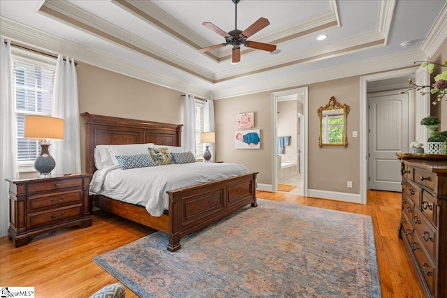 112 Griffith Hill Way, Greer, SC 29650 - bedroom featuring a tray ceiling, ornamental molding, light wood-style floors, ensuite bathroom, and ceiling fan