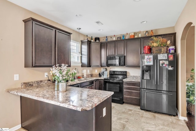 8 Rivanna Dr, Anderson, SC 29625 - kitchen with black appliances, dark brown cabinetry, a peninsula, light stone counters, and recessed lighting