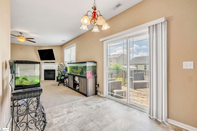 8 Rivanna Dr, Anderson, SC 29625 - living room with a glass covered fireplace, a chandelier, and ceiling fan
