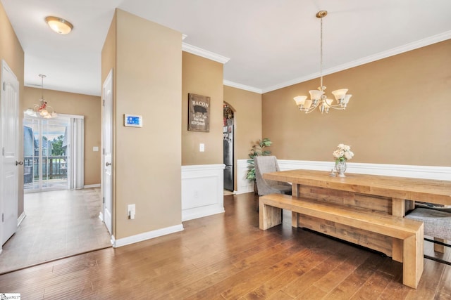 8 Rivanna Dr, Anderson, SC 29625 - dining area with a chandelier, wood finished floors, and ornamental molding