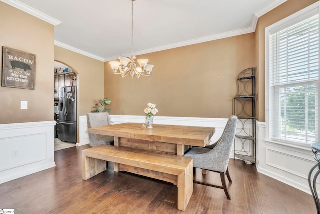 8 Rivanna Dr, Anderson, SC 29625 - dining space featuring arched walkways, ornamental molding, a chandelier, wood finished floors, and a wainscoted wall