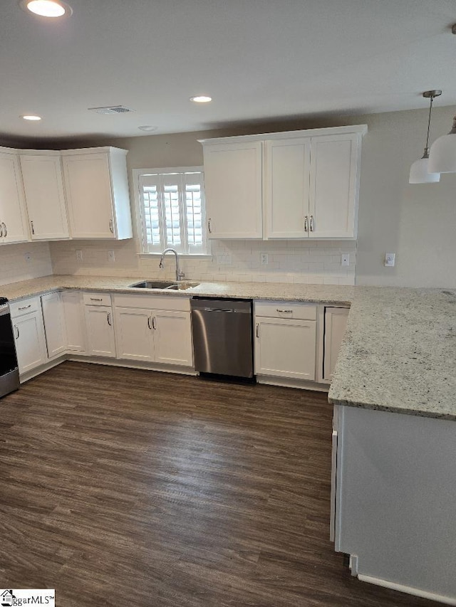 303 Plantation Pt, Anderson, SC 29625 - kitchen with appliances with stainless steel finishes, white cabinets, decorative backsplash, dark wood finished floors, and decorative light fixtures