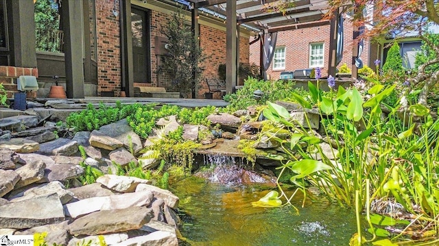 502 Sugar Valley Ct, Greer, SC 29650 - view of yard featuring a garden pond and a pergola