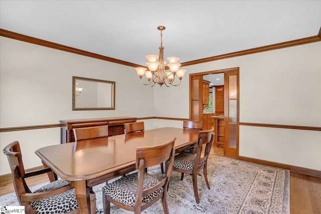 502 Sugar Valley Ct, Greer, SC 29650 - dining area featuring ornamental molding, a chandelier, and light wood finished floors