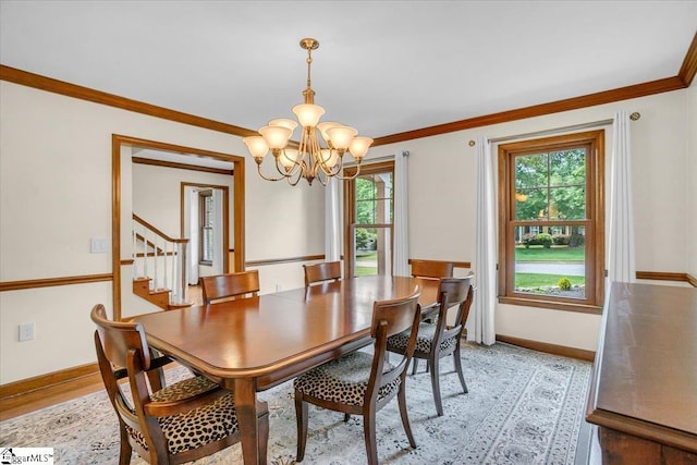 502 Sugar Valley Ct, Greer, SC 29650 - dining room with a chandelier, plenty of natural light, ornamental molding, stairway, and light wood finished floors