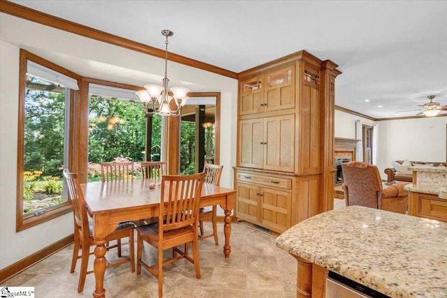 502 Sugar Valley Ct, Greer, SC 29650 - dining area with crown molding, a chandelier, a fireplace, and a ceiling fan