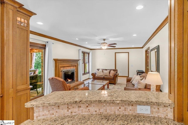 502 Sugar Valley Ct, Greer, SC 29650 - living area featuring crown molding, a tiled fireplace, recessed lighting, plenty of natural light, and a ceiling fan