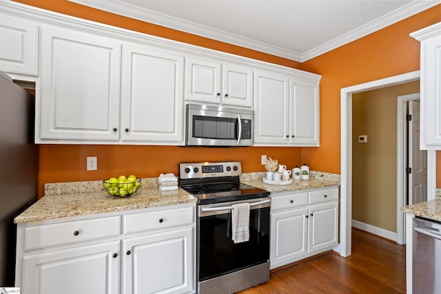 802 Wheat Ct, Greer, SC 29651 - kitchen with appliances with stainless steel finishes, white cabinetry, dark wood-type flooring, crown molding, and light stone countertops