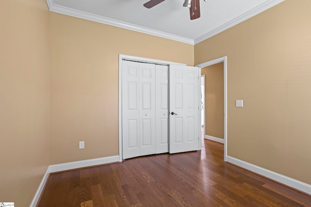 802 Wheat Ct, Greer, SC 29651 - unfurnished bedroom featuring dark wood finished floors, ornamental molding, a closet, and a ceiling fan