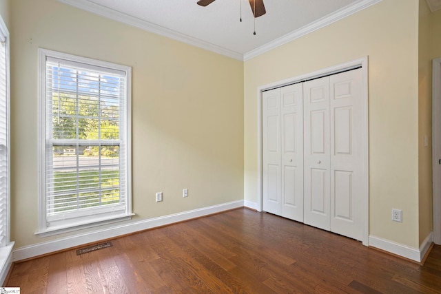 802 Wheat Ct, Greer, SC 29651 - unfurnished bedroom featuring crown molding, dark wood-style floors, a closet, and ceiling fan