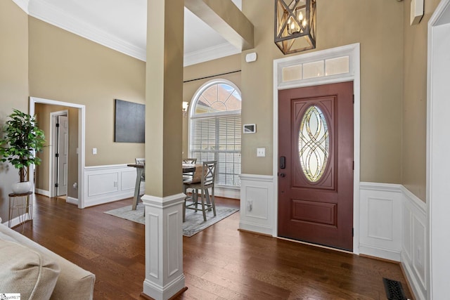 802 Wheat Ct, Greer, SC 29651 - foyer with a decorative wall, a towering ceiling, dark wood-type flooring, ornamental molding, and wainscoting