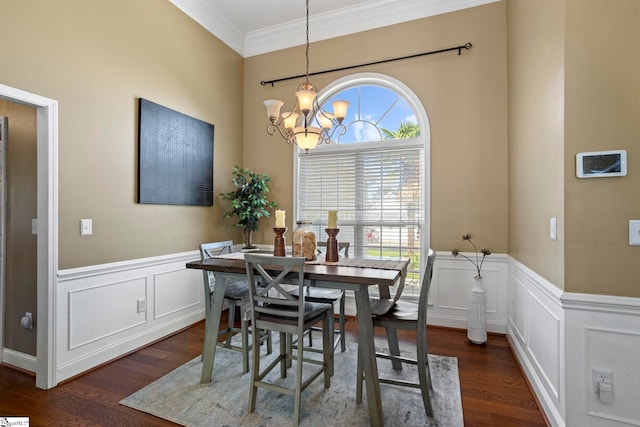 802 Wheat Ct, Greer, SC 29651 - dining area featuring a chandelier, dark wood-style floors, ornamental molding, a decorative wall, and wainscoting