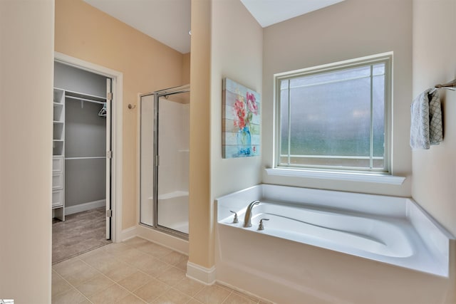 402 Birchbark Ln, Lyman, SC 29365 - full bath featuring a stall shower, a bath, a walk in closet, and tile patterned floors