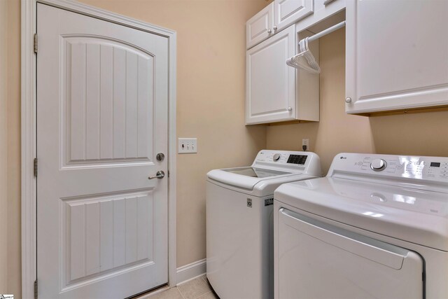 402 Birchbark Ln, Lyman, SC 29365 - washroom featuring cabinet space, washer and dryer, and light tile patterned floors