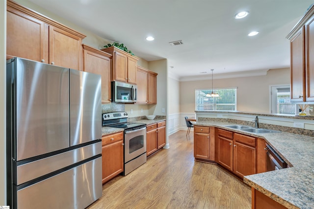 402 Birchbark Ln, Lyman, SC 29365 - kitchen featuring appliances with stainless steel finishes, ornamental molding, light wood-style flooring, wainscoting, and recessed lighting