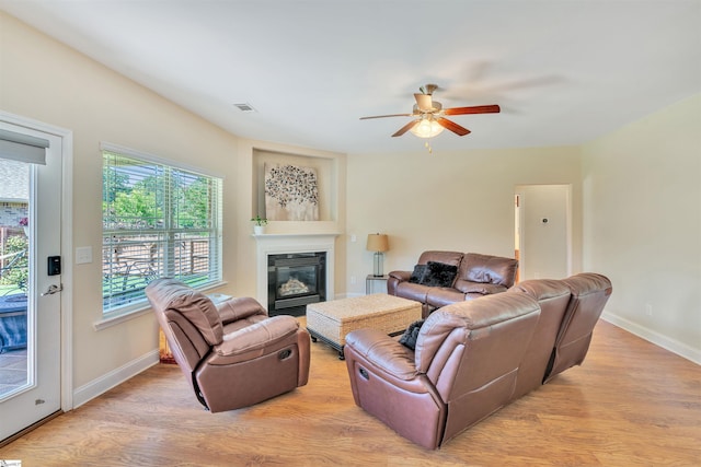 402 Birchbark Ln, Lyman, SC 29365 - living room with a ceiling fan, light wood-style floors, and a glass covered fireplace