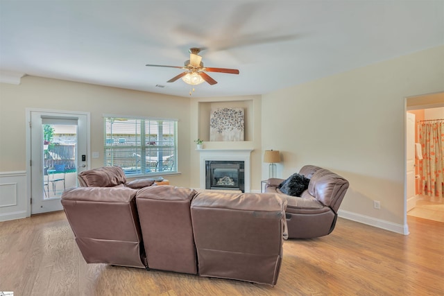 402 Birchbark Ln, Lyman, SC 29365 - living area with a ceiling fan, wood finished floors, and a glass covered fireplace