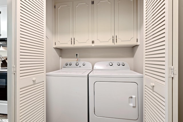 310 Downs Blvd, Clemson, SC 29631 - laundry room with washing machine and dryer and cabinet space