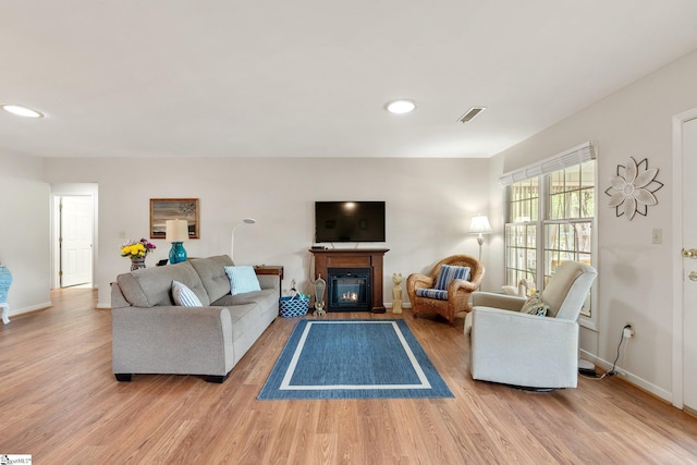 310 Downs Blvd, Clemson, SC 29631 - living area with wood finished floors, recessed lighting, and a glass covered fireplace