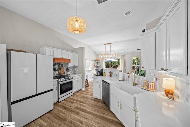 521 Omniwood Ct, Greer, SC 29651 - kitchen featuring appliances with stainless steel finishes, white cabinetry, tasteful backsplash, light countertops, and light wood-style floors