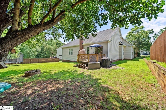 521 Omniwood Ct, Greer, SC 29651 - back of property with an outdoor fire pit, a trampoline, a fenced backyard, crawl space, and a wooden deck