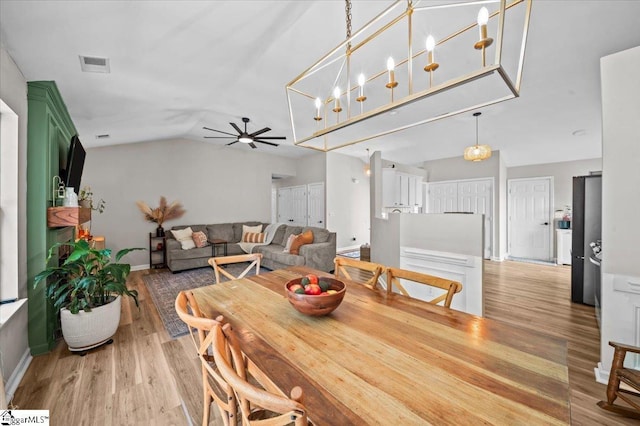 521 Omniwood Ct, Greer, SC 29651 - dining space featuring light wood-type flooring, ceiling fan, and vaulted ceiling