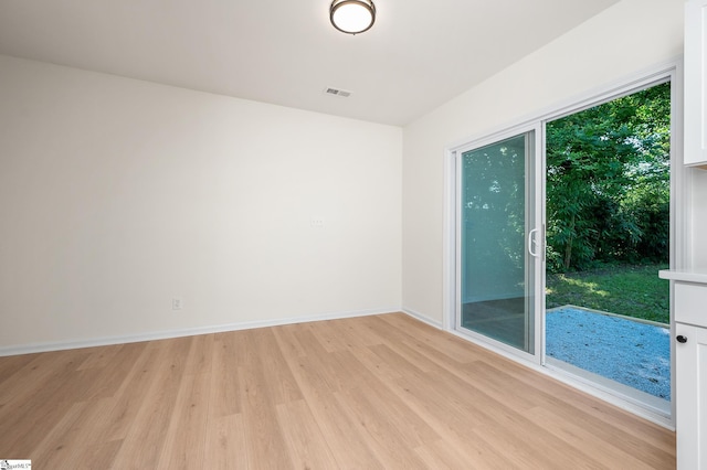 307 Echols St, Greenville, SC 29601 - empty room featuring light wood-style flooring and baseboards