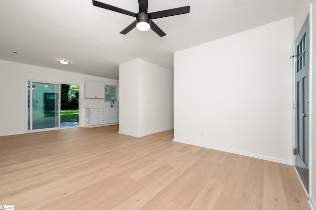 307 Echols St, Greenville, SC 29601 - unfurnished living room with light wood-type flooring and ceiling fan
