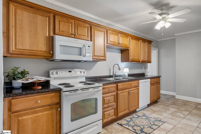 1706 Park Dr, Anderson, SC 29625 - kitchen featuring white appliances, crown molding, a ceiling fan, brown cabinetry, and dark stone countertops