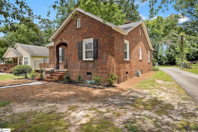 1706 Park Dr, Anderson, SC 29625 - view of front facade featuring brick siding, a chimney, and asphalt driveway