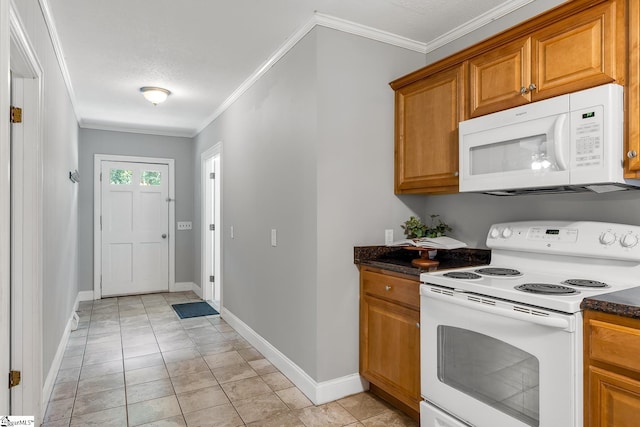 1706 Park Dr, Anderson, SC 29625 - kitchen with white appliances, ornamental molding, and brown cabinets