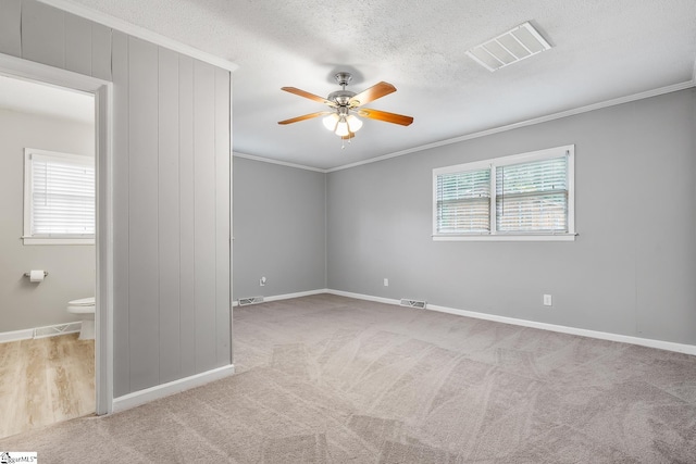 1706 Park Dr, Anderson, SC 29625 - unfurnished room with ornamental molding, ceiling fan, carpet, and a textured ceiling