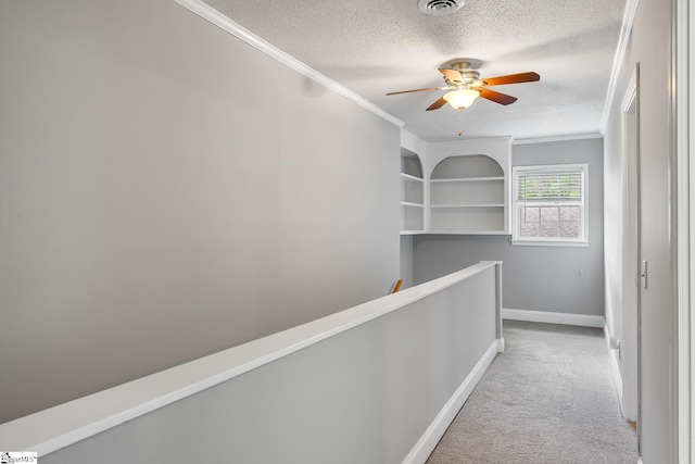 1706 Park Dr, Anderson, SC 29625 - hallway with ornamental molding, carpet flooring, a textured ceiling, and an upstairs landing