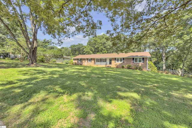 505 E Hackney Rd, Greer, SC 29650 - ranch-style house with a front yard, brick siding, and view of scattered trees