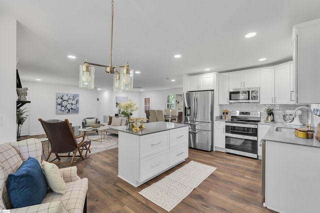 505 E Hackney Rd, Greer, SC 29650 - kitchen with appliances with stainless steel finishes, open floor plan, backsplash, recessed lighting, and white cabinetry