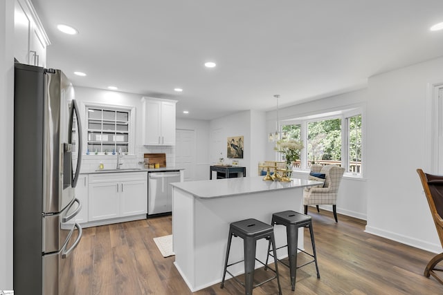 505 E Hackney Rd, Greer, SC 29650 - kitchen featuring stainless steel appliances, white cabinets, a kitchen bar, dark wood-type flooring, and recessed lighting