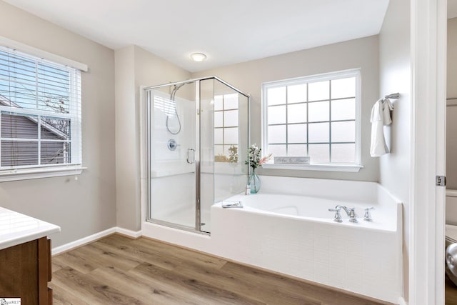 463 Lynnell Way, Moore, SC 29369 - full bathroom with a garden tub, wood finished floors, a shower stall, and vanity