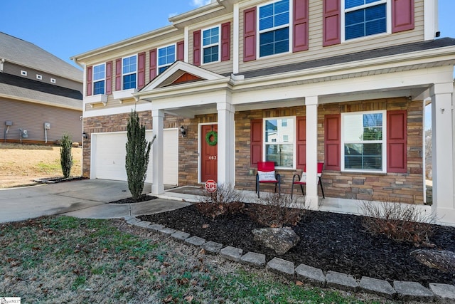 463 Lynnell Way, Moore, SC 29369 - view of front of property with stone siding, a porch, an attached garage, and driveway