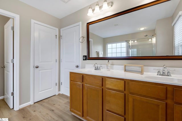 463 Lynnell Way, Moore, SC 29369 - bathroom with wood finished floors, an enclosed shower, and double vanity