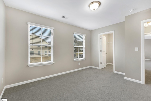 463 Lynnell Way, Moore, SC 29369 - unfurnished bedroom featuring carpet floors, a spacious closet, and a closet