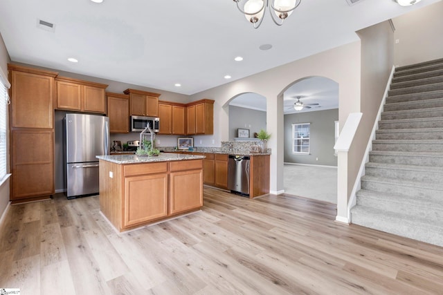 463 Lynnell Way, Moore, SC 29369 - kitchen featuring appliances with stainless steel finishes, a ceiling fan, a center island, light stone countertops, and recessed lighting